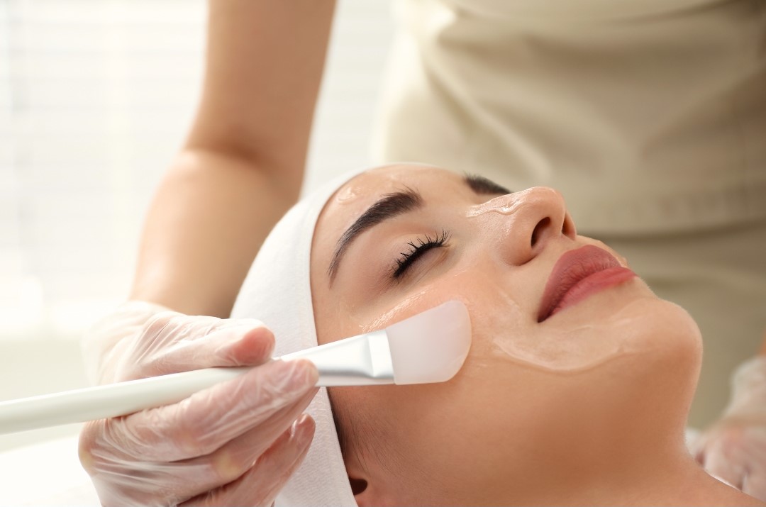 woman receiving chemical peel treatment