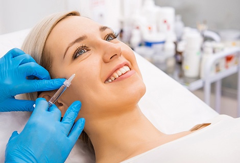 woman doing juvederm volite treatment on face