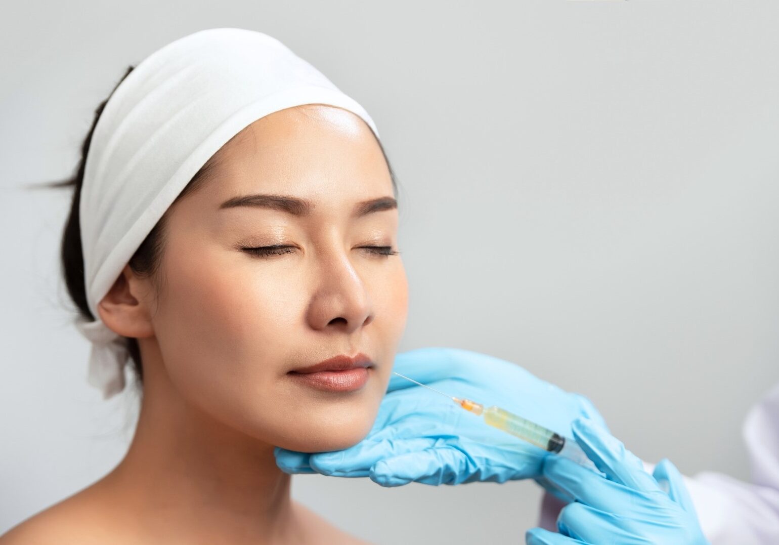 woman doing injectable rejuran treatment