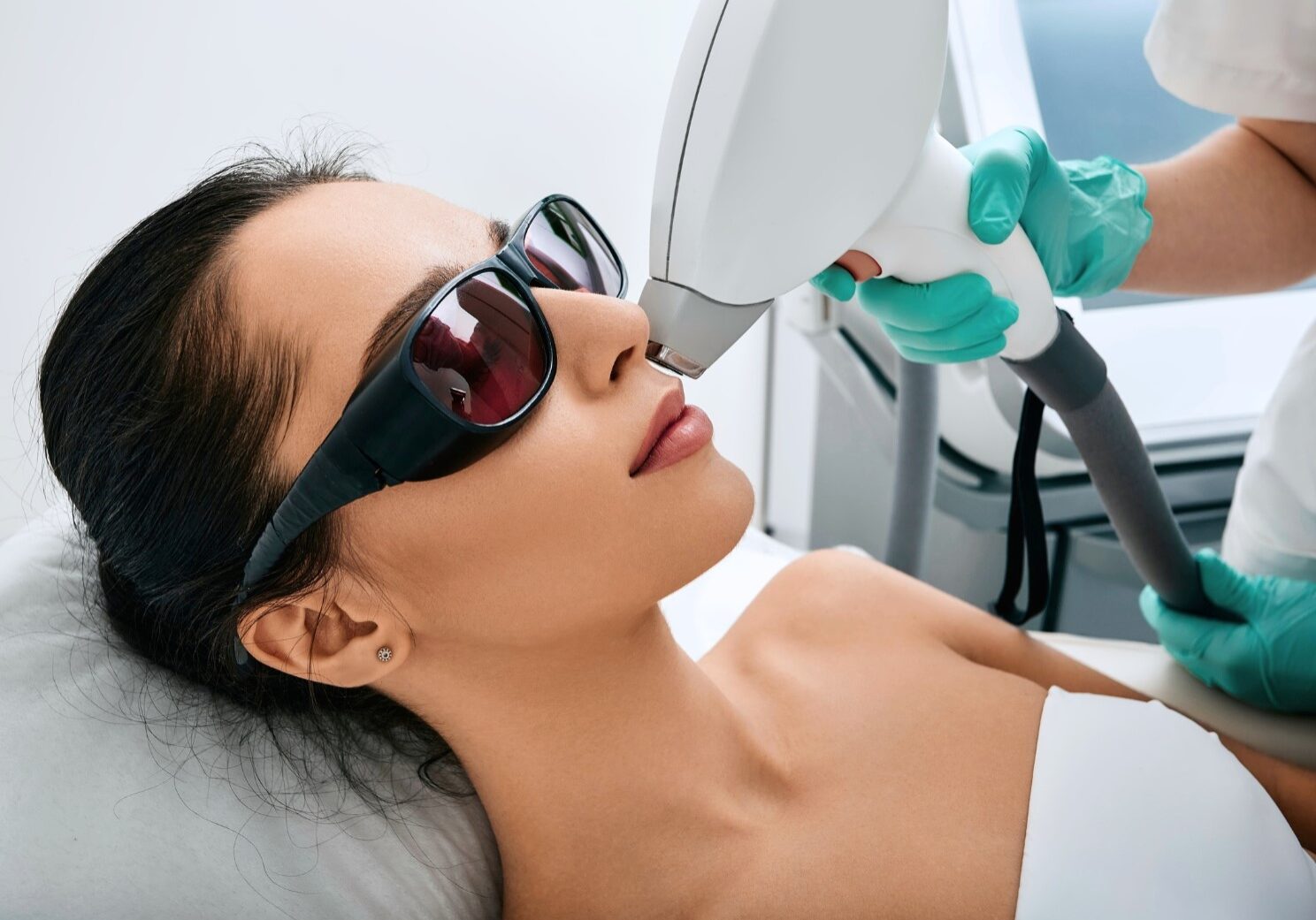 woman undergoing total clarity laser treatment