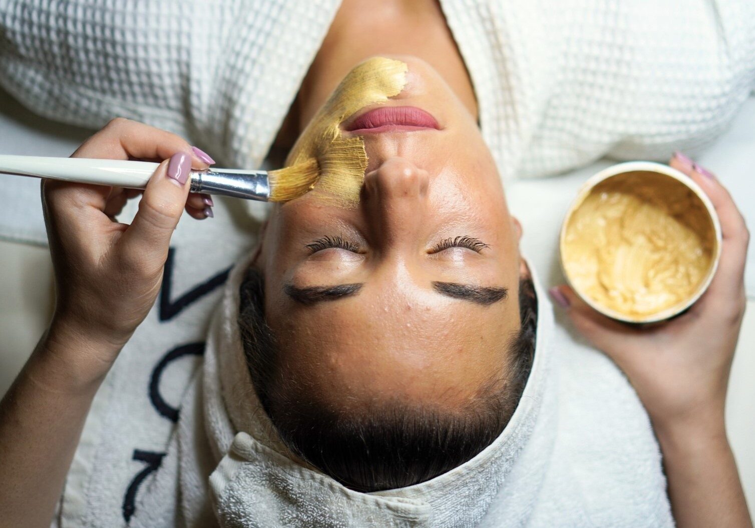 woman doing gold facial